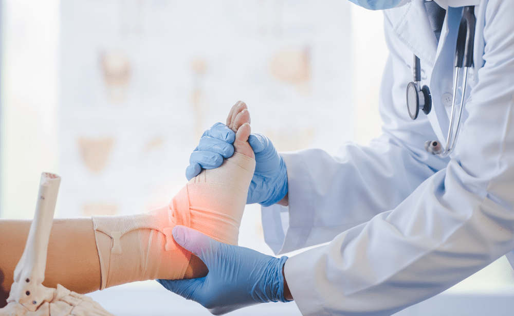 doctor examining ankle in a cast