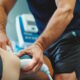physical therapist using cryotherapy on athlete