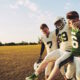 football player with injury walking off field