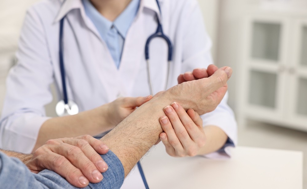 doctor examining patient wrist