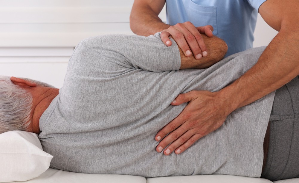 orthopedic specialist adjusting patients back