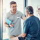 physical therapist consulting with patient