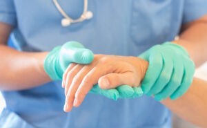 hand doctor holding patients hand