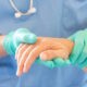 hand doctor holding patients hand