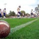football players and ball on field