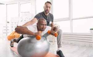 man exercising in physical therapy