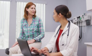 patient talking with a hand doctor