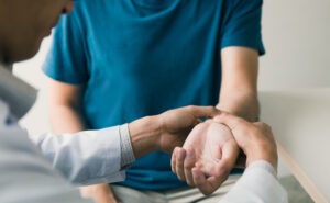hand doctor examining a wrist