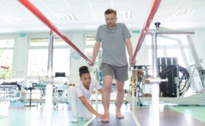 man walking during physical therapy