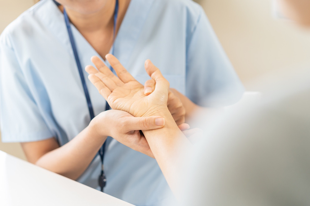 hand specialist inspecting wrist