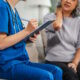 woman in pain talking to doctor